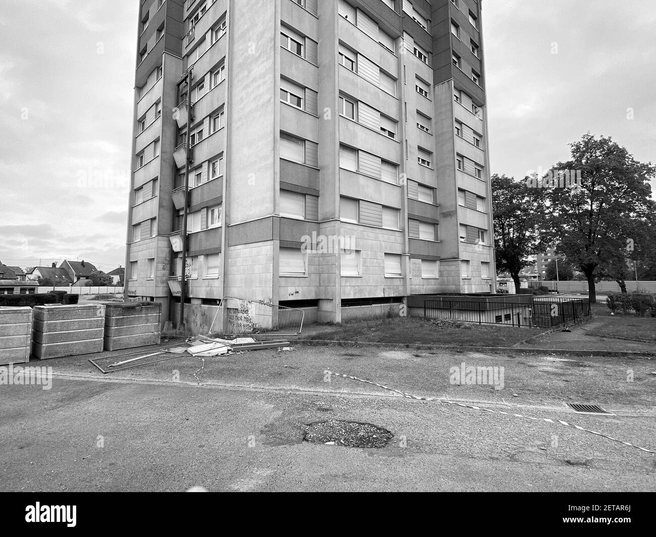 Strasbourg, France - Oct 17, 2020: Tall abandoned apartment building Habitation a Loyer Modere, generally called HLM, is a form of low-income housing in France, and other French speaking countries - black and white image Stock Photo