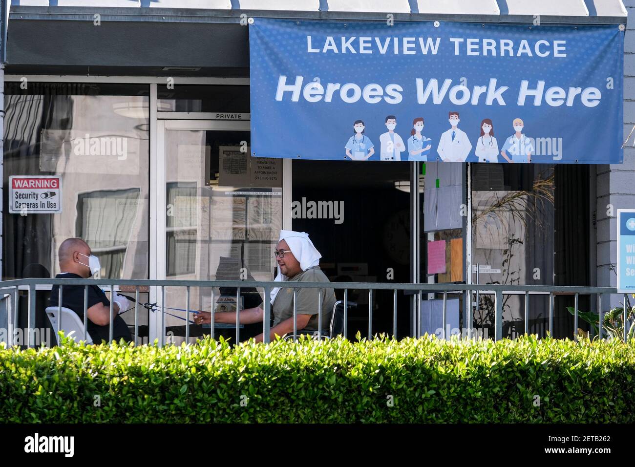 Los Angeles, California, USA. 1st Mar, 2021. People are seen at Lakeview Terrace Skilled Nursing Facility in Los Angeles, March 1, 2021. Los Angeles City Attorney Mike Feuer announced today his office reached a settlement with Lakeview Terrace Skilled Nursing Facility, which was accused of patient dumping during the COVID-19 pandemic, as well as abuse, neglect, denial of care and efforts to conceal its conduct. Credit: Ringo Chiu/ZUMA Wire/Alamy Live News Stock Photo