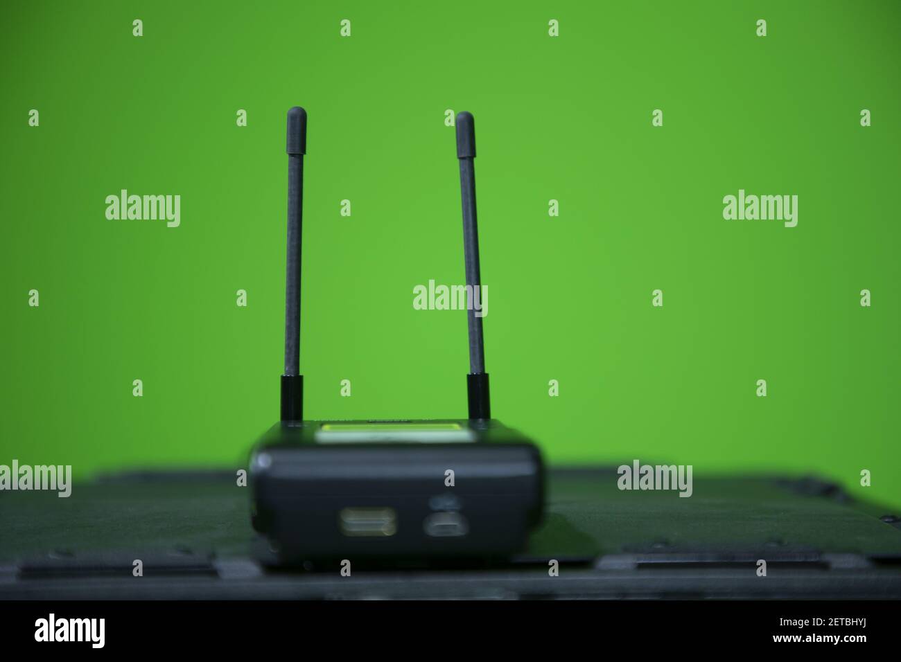 Close up view of wireless microphone receiver in chroma shooting studio. wireless receiver Stock Photo