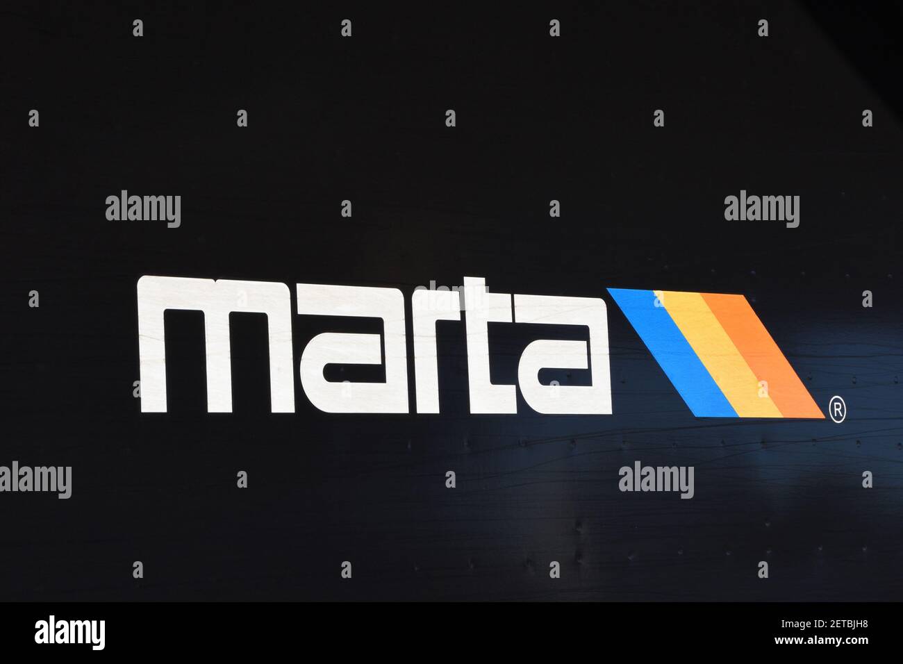 Marta train logo (Metropolitan Atlanta Rapid Transit Authority), Atlanta, Georgia, USA. Black background. Stock Photo