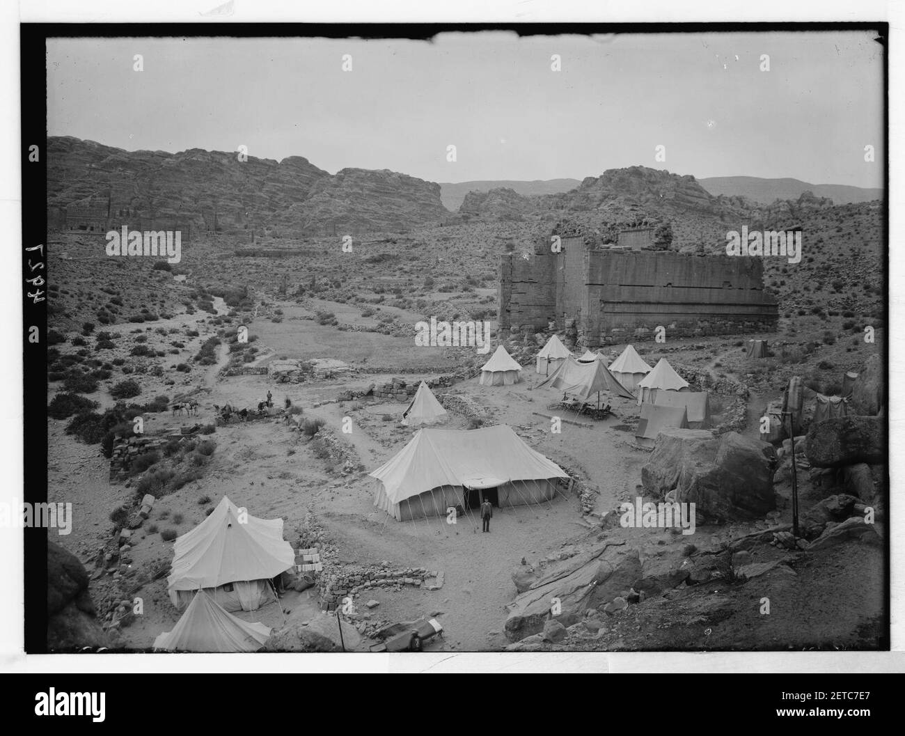 Petra (Wadi Musa). El-Habis area. Qasr Bint Far'on. A Roman temple; the only masonry monument left in Petra. Cook's camp in foreground Stock Photo