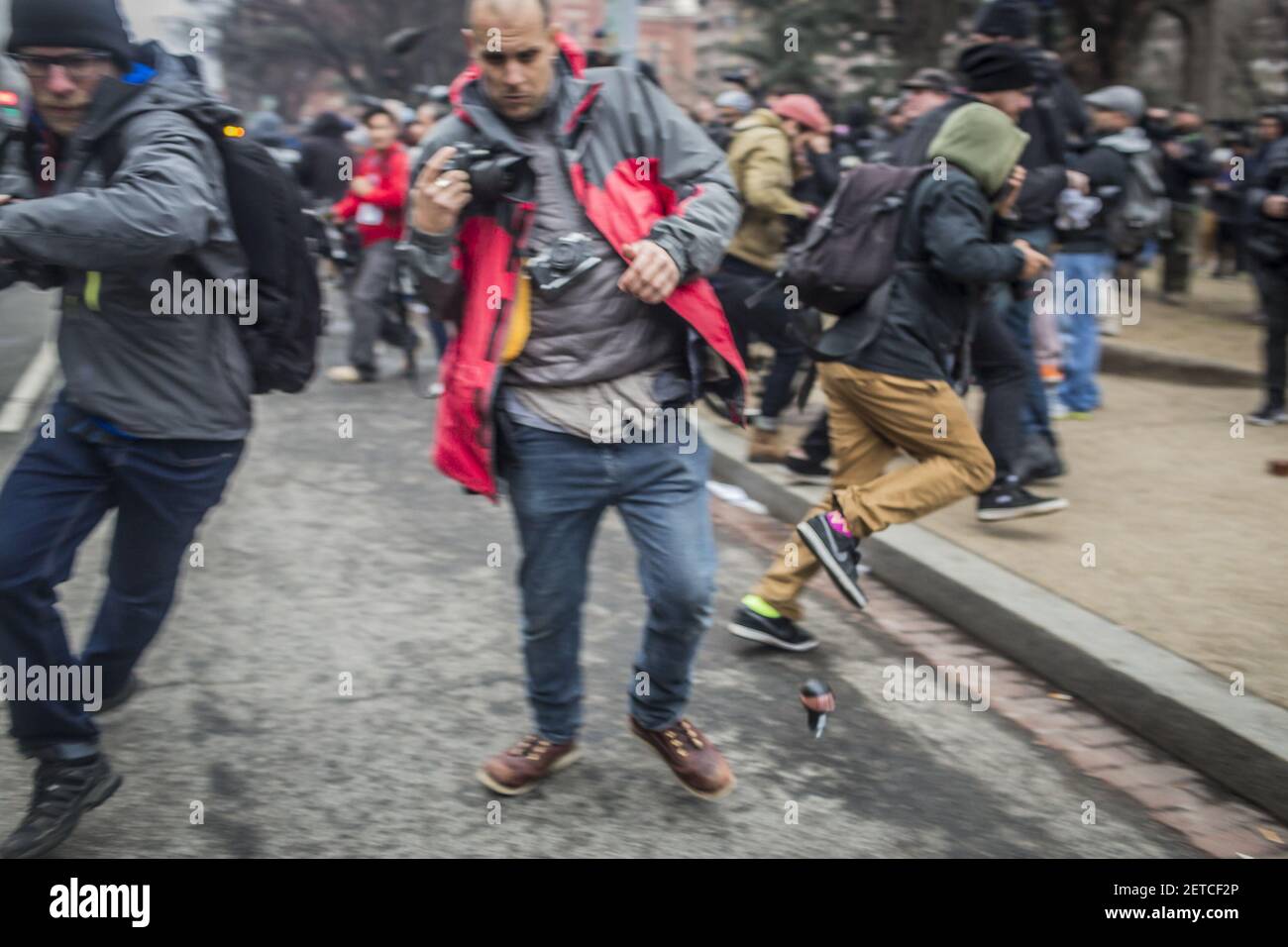 Hours after Donald Trump was swore in as the 45th President of the United States, On January, 20, 2017, ??protesters clashed with riot police, who launched flash grenades and sprayed pepper spray into ?the packed streets. (Photo by Michael Nigro) *** Please Use Credit from Credit Field *** Stock Photo