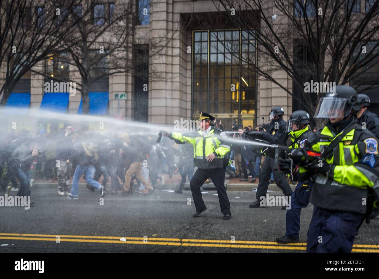 Hours after Donald Trump was swore in as the 45th President of the United States, On January, 20, 2017, ??protesters clashed with riot police, who launched flash grenades and sprayed pepper spray into ?the packed streets. (Photo by Michael Nigro) *** Please Use Credit from Credit Field *** Stock Photo