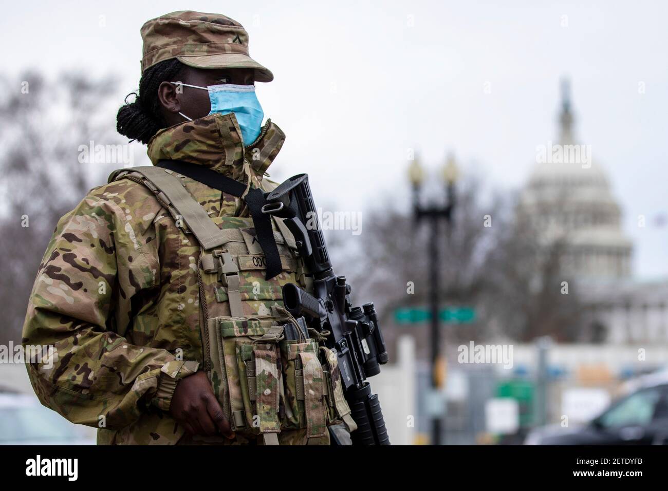 Washington, United States. 01st Mar, 2021. U.S. Army Pvt. Precious Odoom, with the New York National Guard, stands watch near the U.S. Capitol March 1, 2021 in Washington, DC The National Guard will continue supporting federal law enforcement agencies with security around the Capitol until the end of March. Credit: Planetpix/Alamy Live News Stock Photo