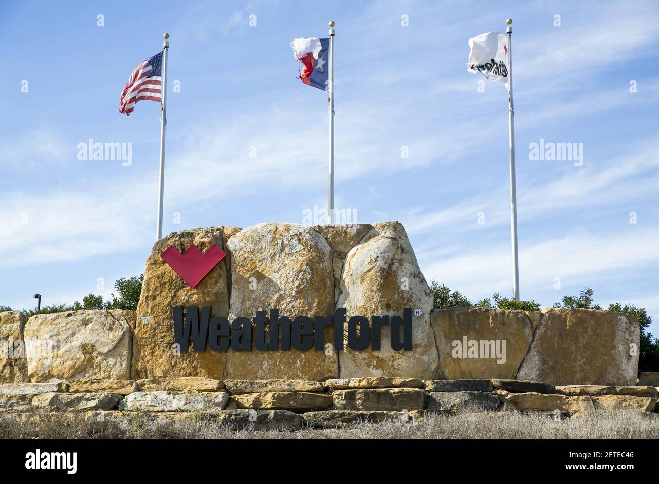 A logo sign outside of a facility occupied by Weatherford in Elmendorf