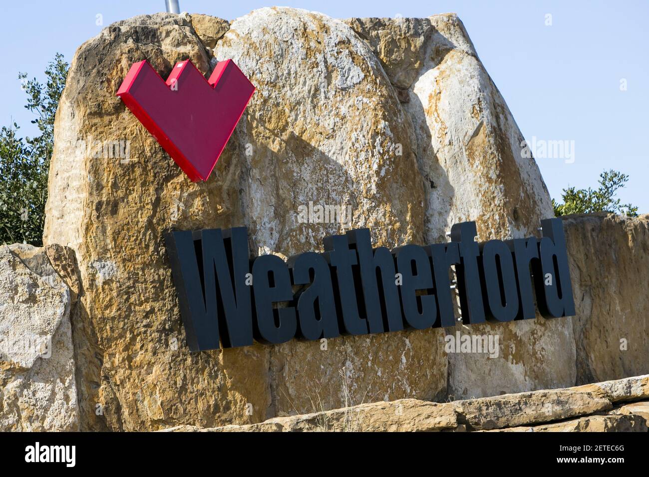 A logo sign outside of a facility occupied by Weatherford in Elmendorf