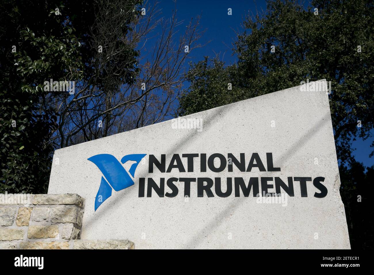 A logo sign outside of the headquarters of the National Instruments ...