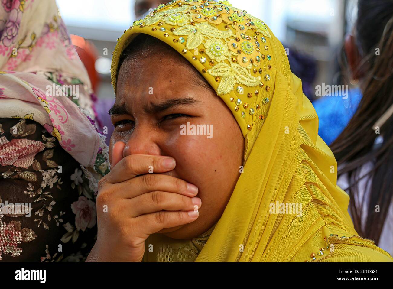 The young girl is seen crying at the funeral of Daw Dasi who was shot dead  by the Myanmar Security Forces on February 28.Myanmar Security Forces fire  rubber bullets, real bullets, tear