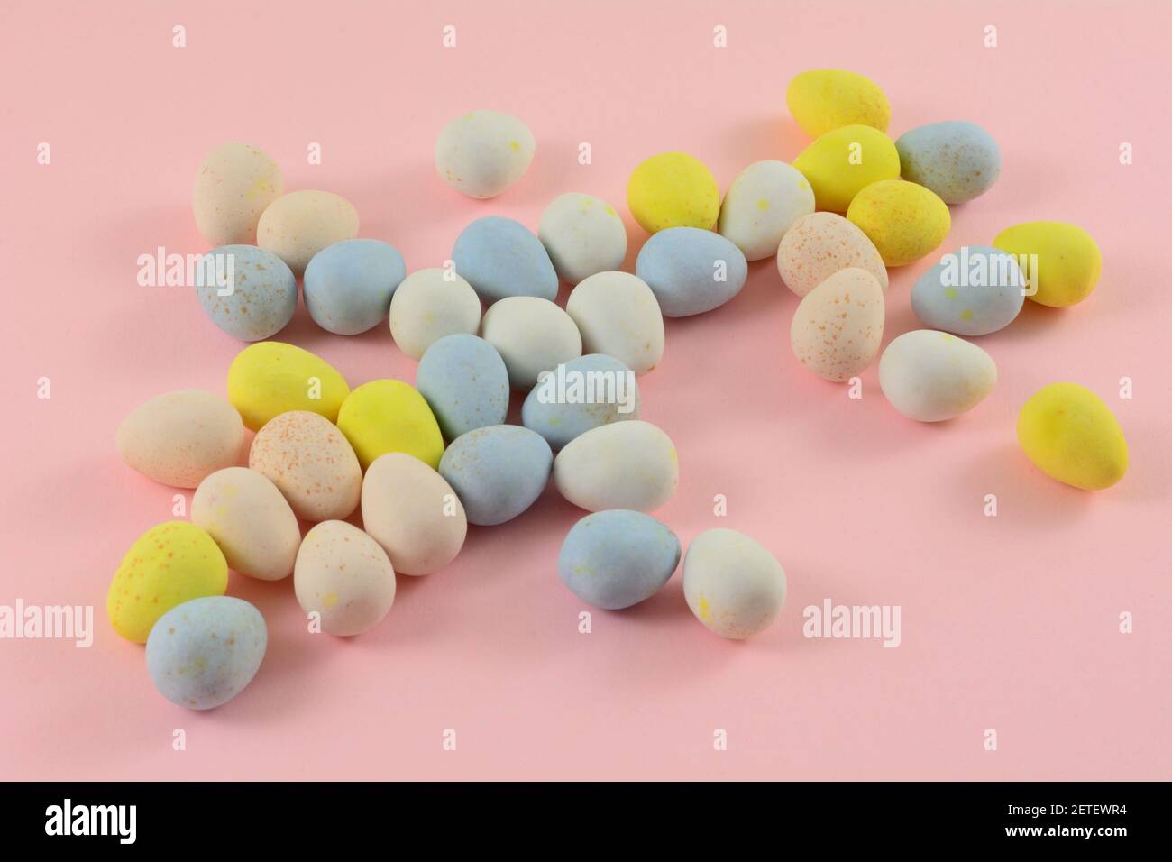 Pastel colored candy covered chocolate Easter eggs Stock Photo