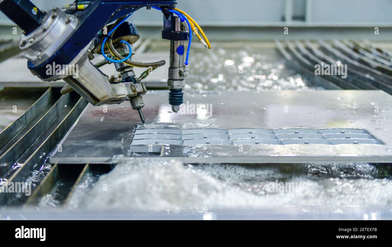Machine for cutting steel plate by CNC water jet , Industrial metalworking Stock Photo