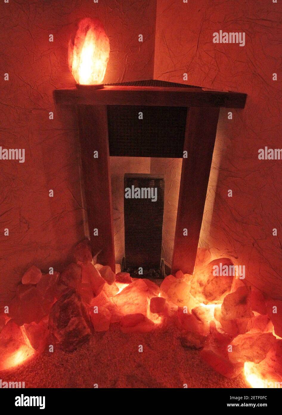 A corner mantle piece frames a fountain in the salt cave at Caveation