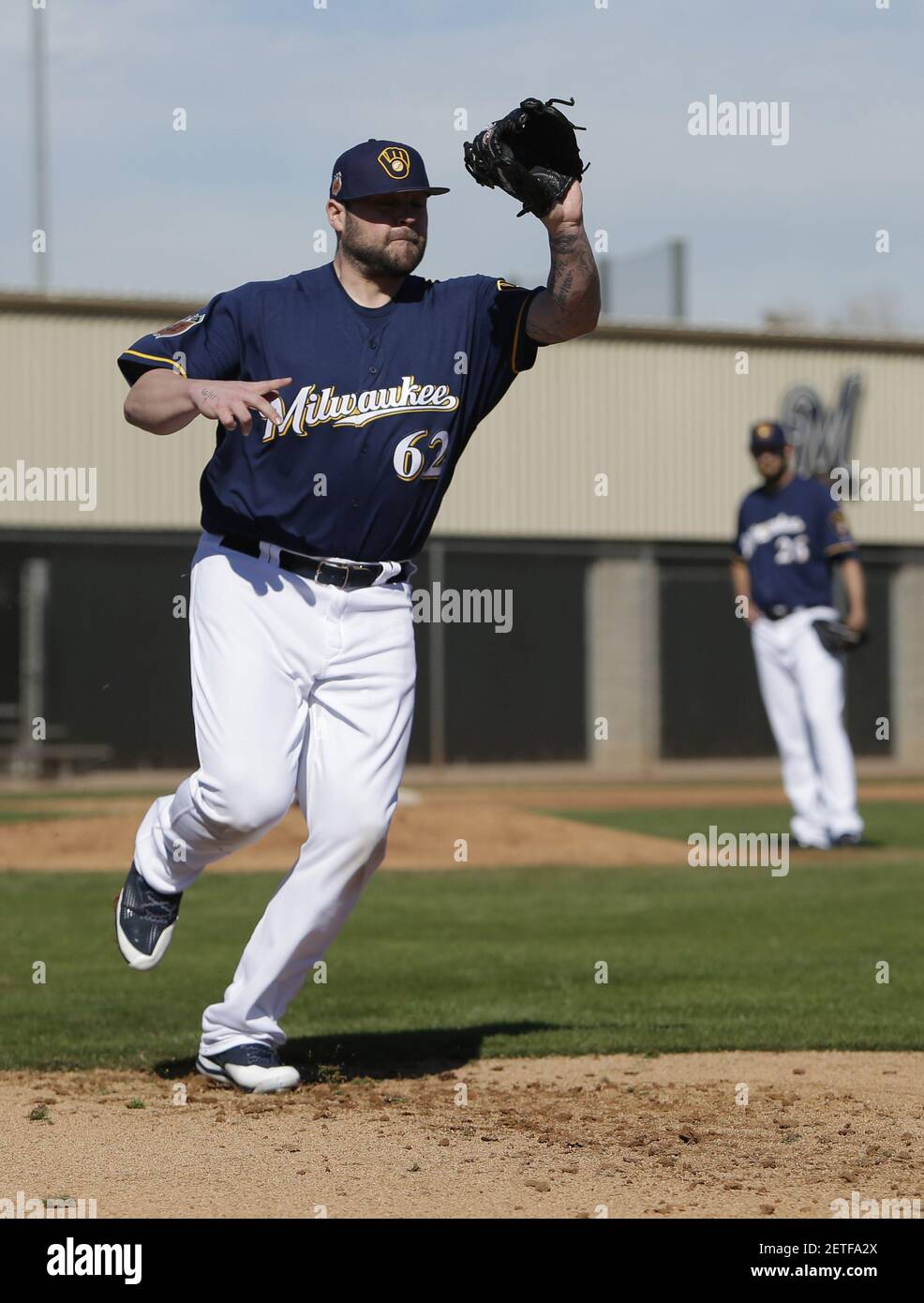 Feb 16, 2017; Maryvale, AZ, USA; Milwaukee Brewers relief pitcher Joba Chamberlain (62) covers first base during spring training camp drills at Maryvale Baseball Park. Mandatory Credit: Rick Scuteri-USA TODAY Sports *** Please Use Credit from Credit Field *** Stock Photo