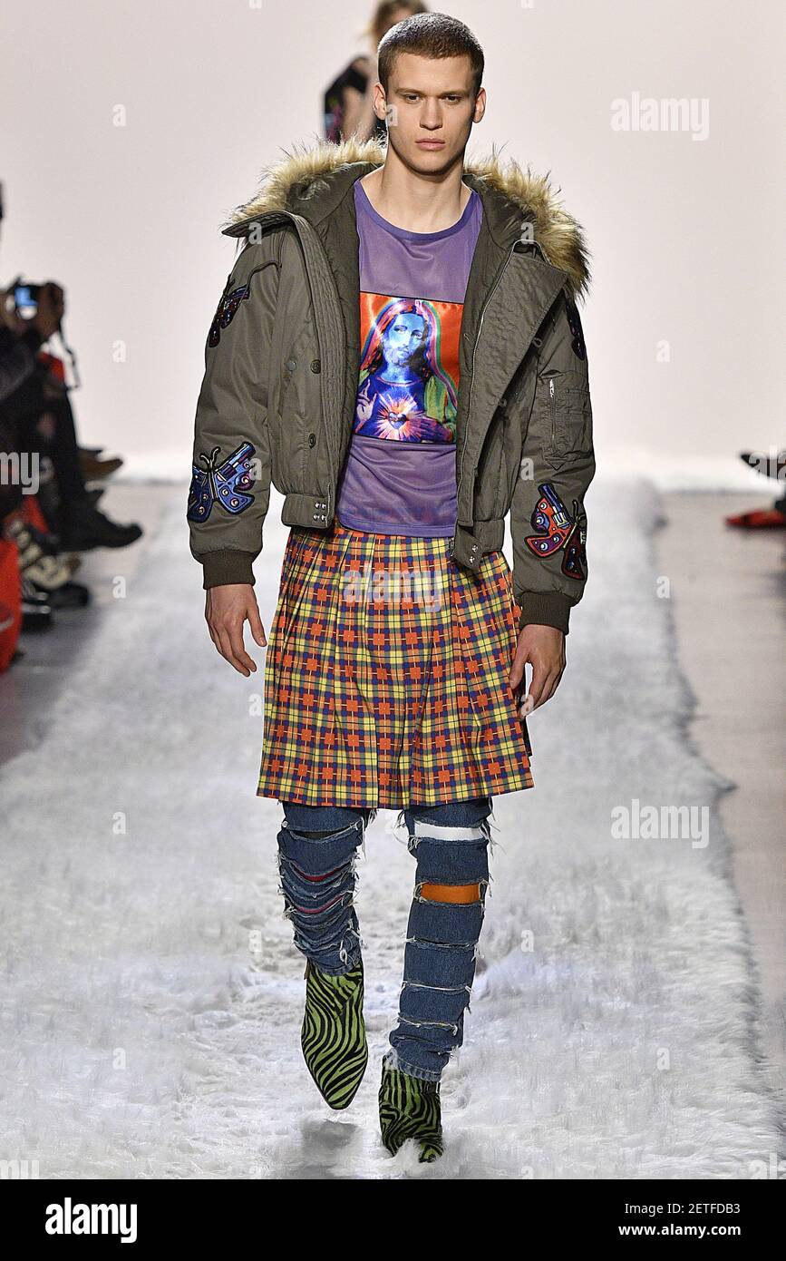 Izack Ruddle Model Zack Riddle walks on the runway during the Jeremy Scott Fashion ...