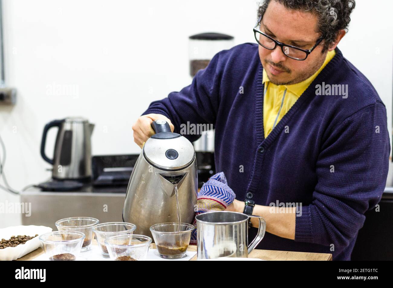 Professional barista testing the taste of a new coffee Stock Photo