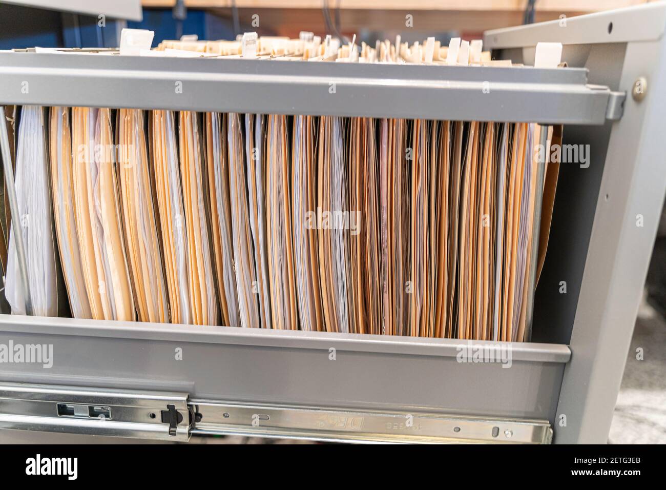 Hanging files in filling cabinet in an office Stock Photo
