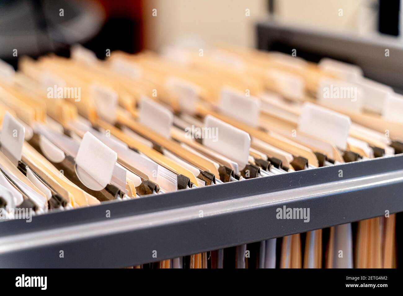 Hanging files in filling cabinet in an office Stock Photo