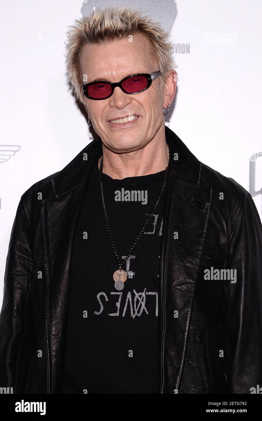 Musician Billy Idol attends artist Plastic Jesus gallery opening at the