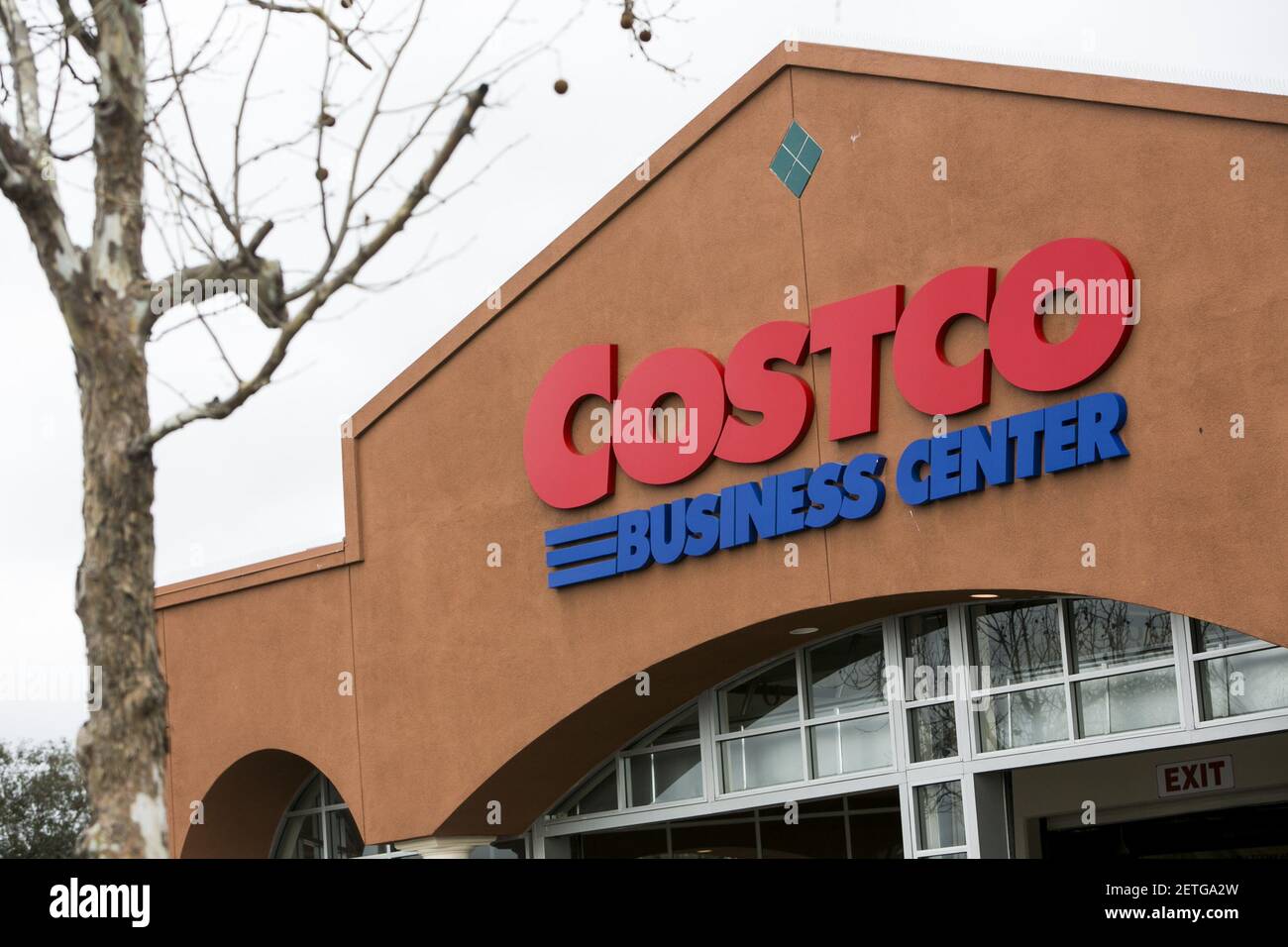 A logo sign outside of a Costco Business Center retail store in Hayward