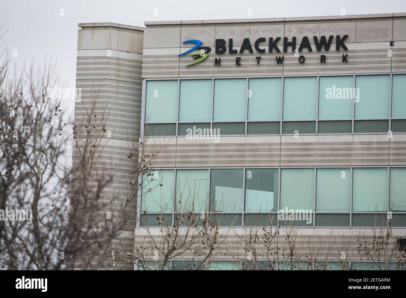 A logo sign outside of the headquarters of Blackhawk Network Holdings ...