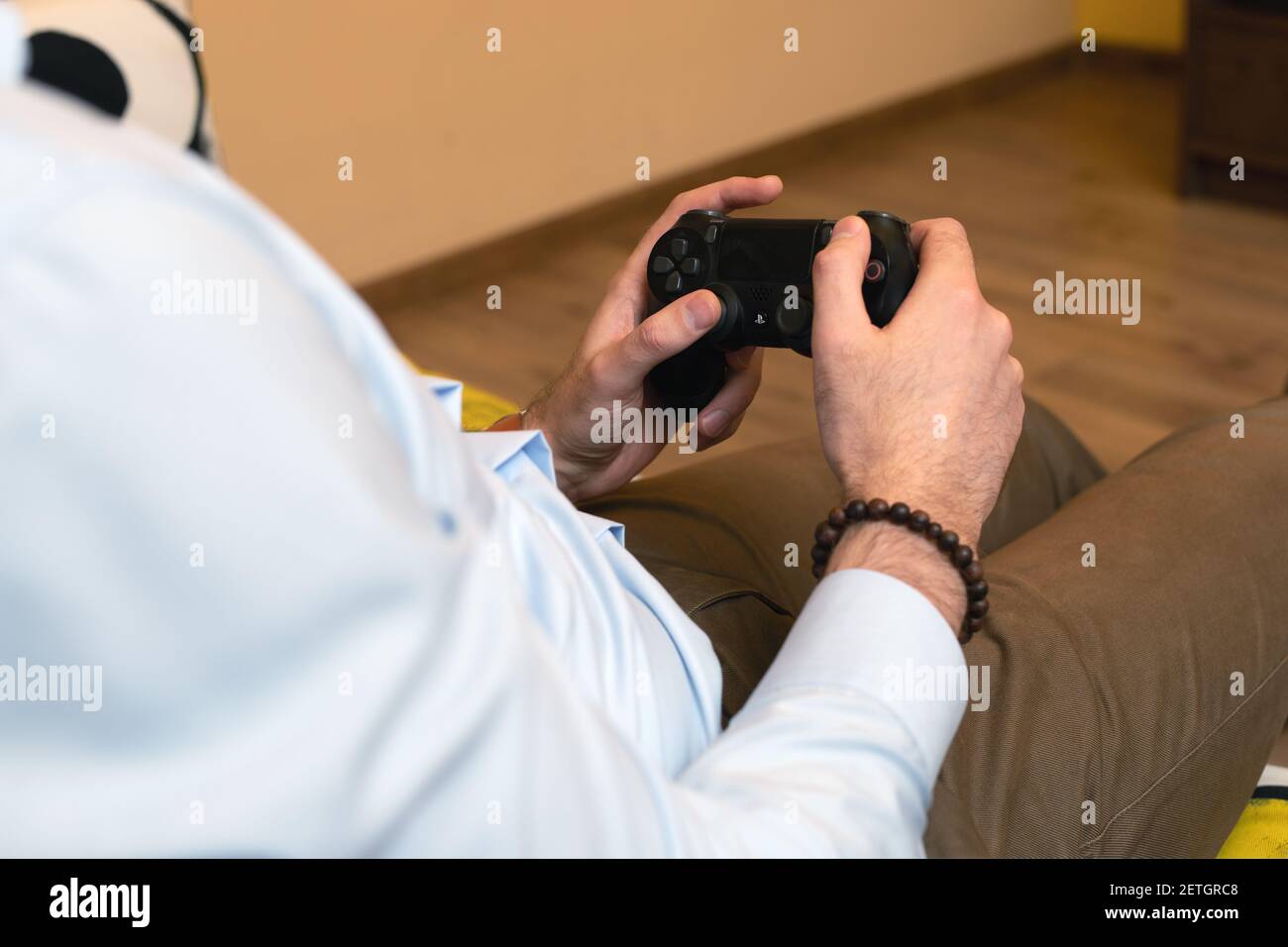 Hand hold modern joystick manipulator. Gamer play game with gamepad