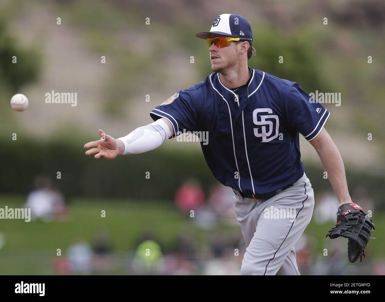 Feb 27, 2017; Tempe, AZ, USA; San Diego Padres first baseman Wil Myers (4) flips the ball for the out against the Los Angeles Angels in the third inning during a spring training game at Tempe Diablo Stadium. Mandatory Credit: Rick Scuteri-USA TODAY Sports *** Please Use Credit from Credit Field *** Stock Photo