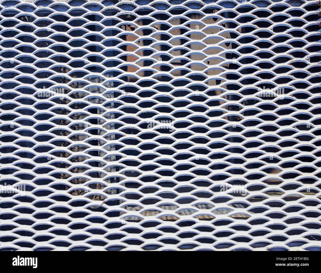 White metal staircase grid background. Metal mesh texture Stock Photo
