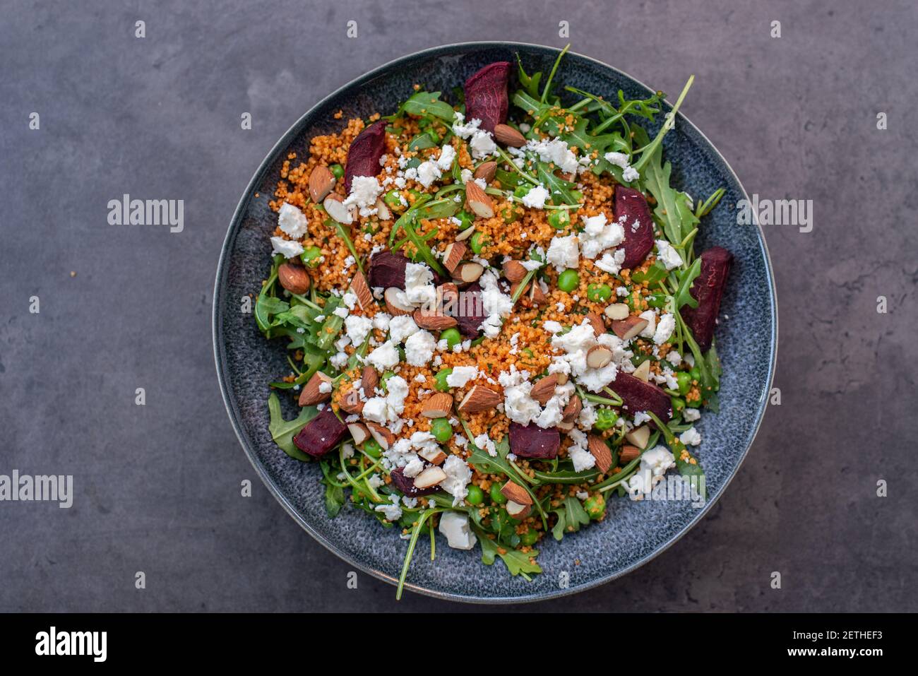 healthy home made couscous salad with sweet potato, beetroot and feta cheese Stock Photo