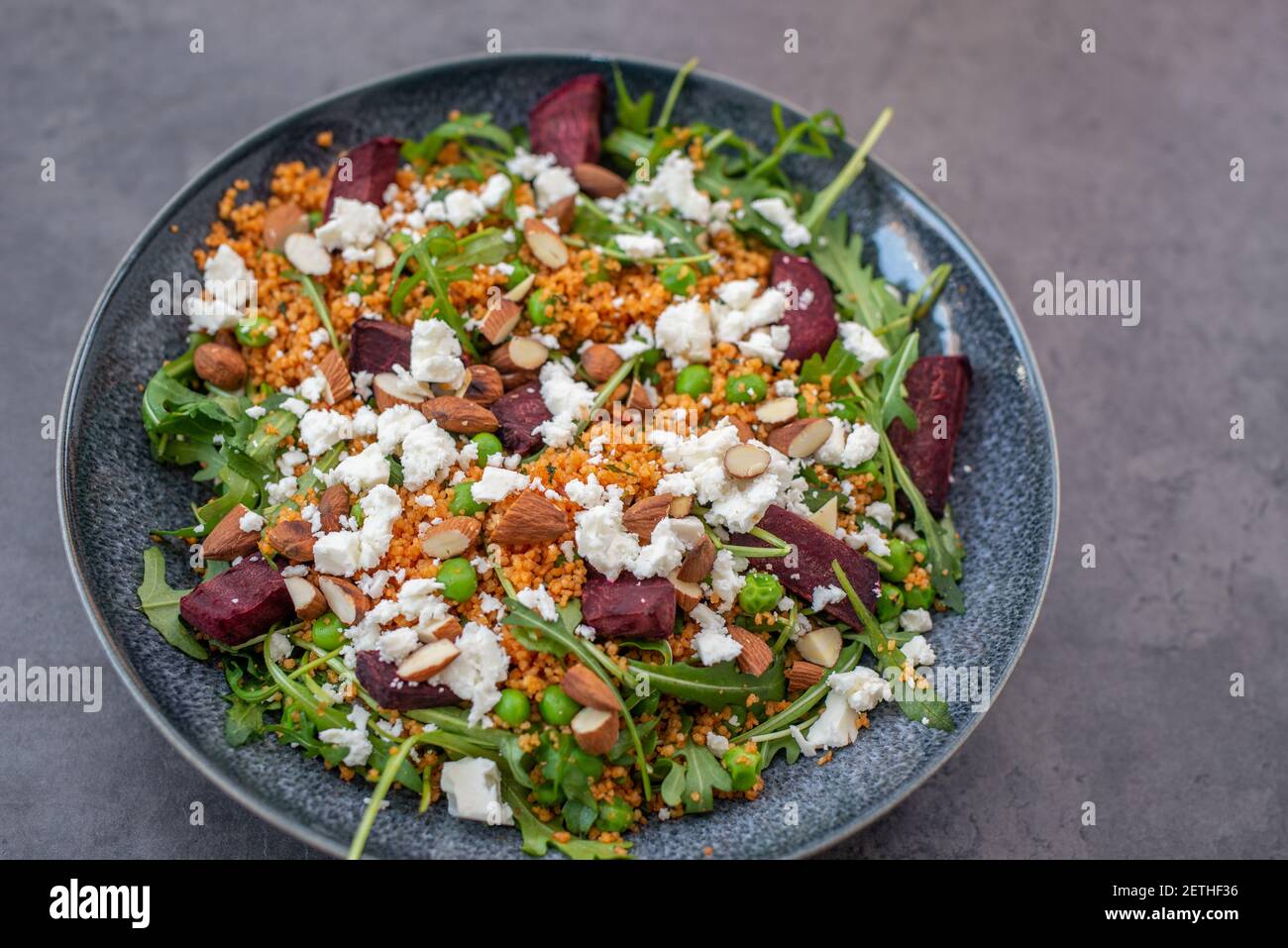 healthy home made couscous salad with sweet potato, beetroot and feta cheese Stock Photo
