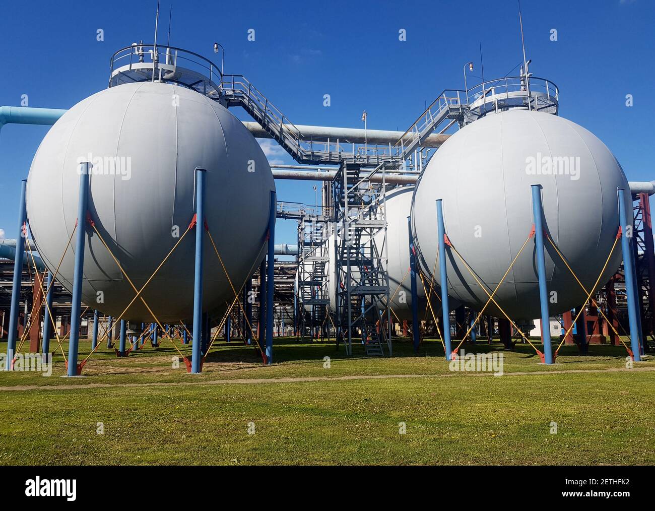 Spherical metal underground fuel storage container Stock Photo - Alamy