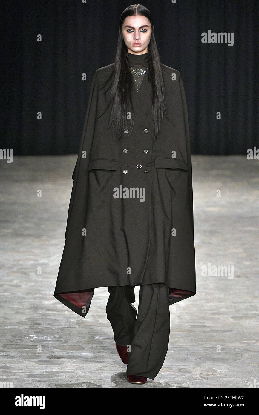 Model Tina Veshaguri walks on the runway during the Veronique