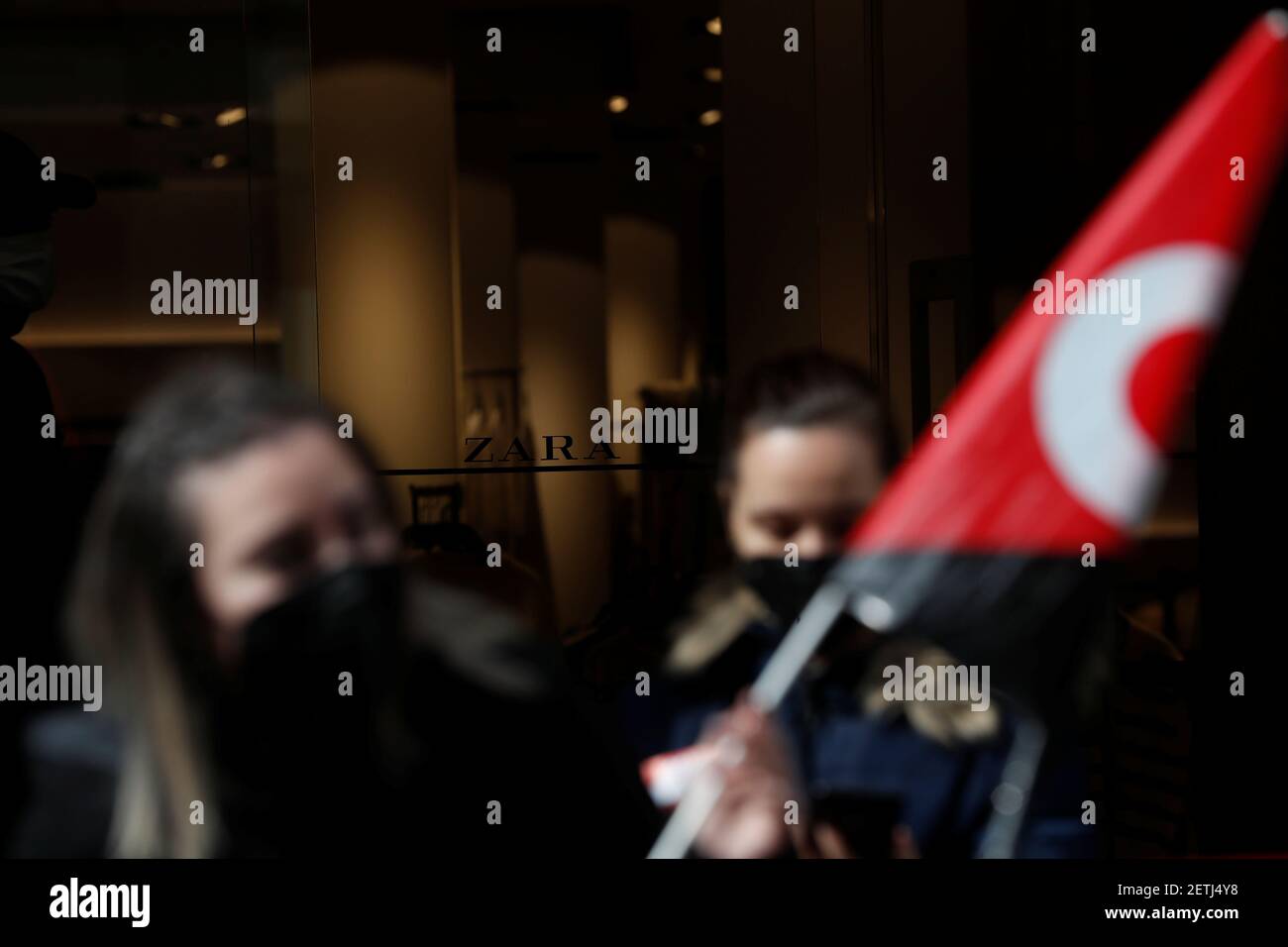 People hold flags from Spain's CGT labour union as they protest outside a  Zara clothing store, an Inditex brand, in Madrid, Spain, February 25, 2021.  REUTERS/Susana Vera Stock Photo - Alamy