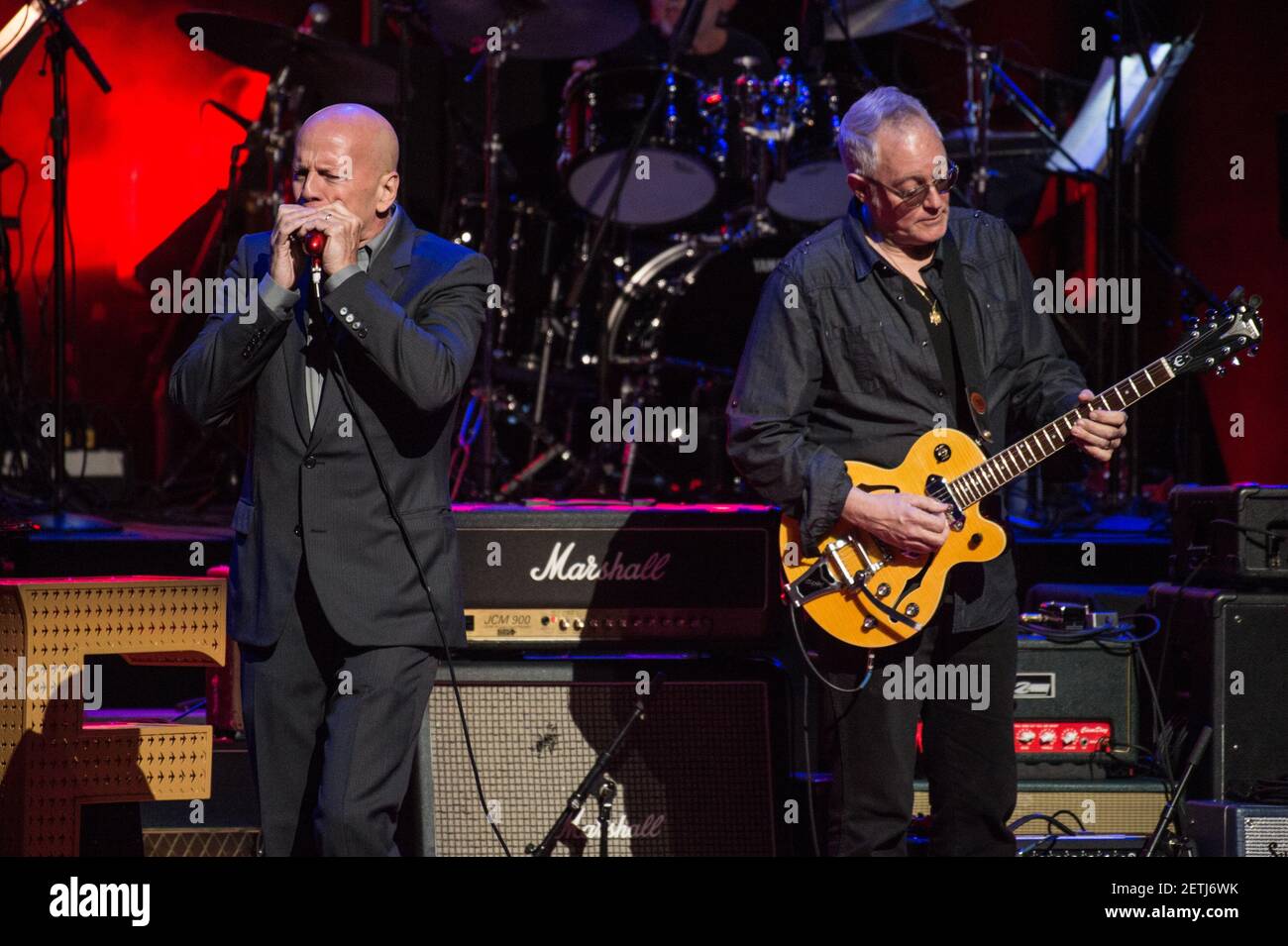 Bruce Willis plays harmonica on stage at Love Rocks NYC! A Change is Gonna  Come: Celebrating Songs of Peace, Love and Hope, a benefit concert for  God's Love We Deliver at Beacon
