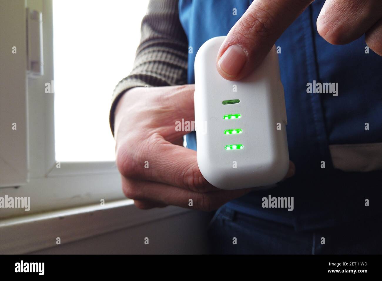 man checking drone battery charge Stock Photo