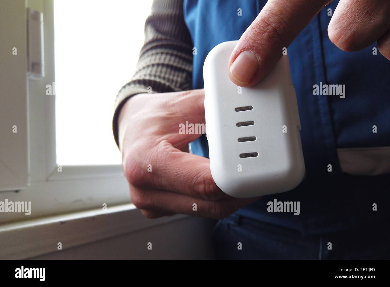 man checking drone battery charge Stock Photo