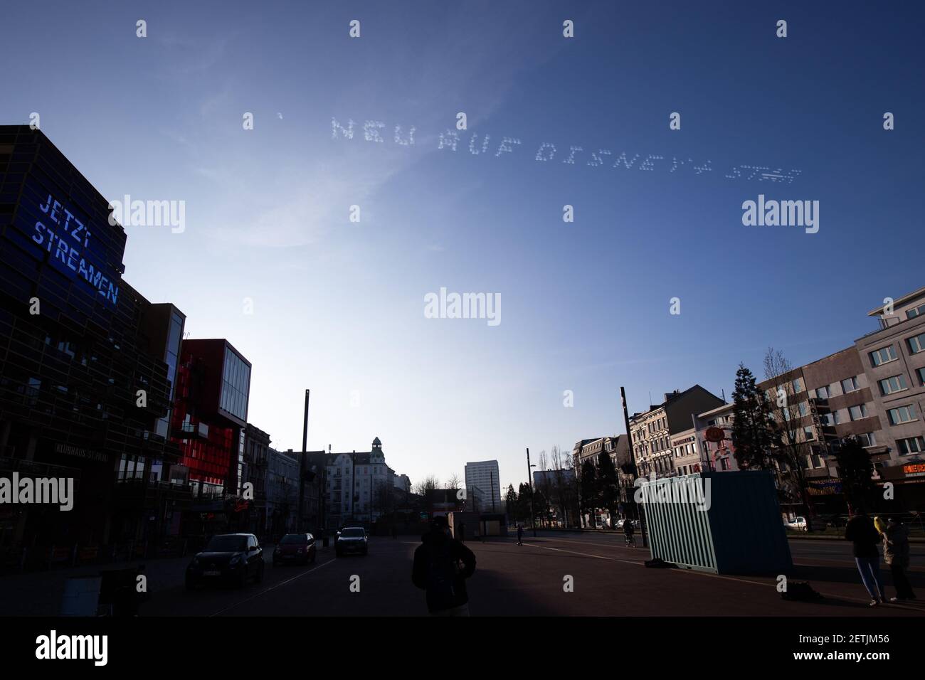 Hamburg, Germany. 01st Mar, 2021. The words "New on Disney Star" can be  read in the sky above the Reeperbahn. As part of an advertising campaign  for a streaming service, 5 planes