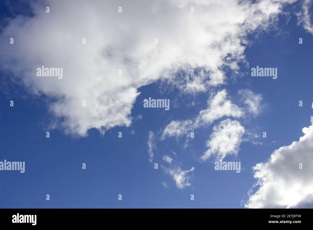 Cloudy day, white clouds in the blue sky, scattered clouds. Stock Photo