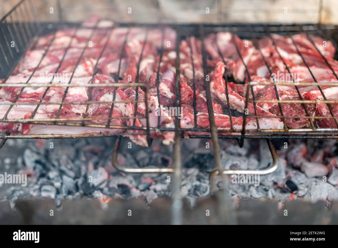 Lamb ribs cooked over an open fire, closeup. Lamb chops Grilling