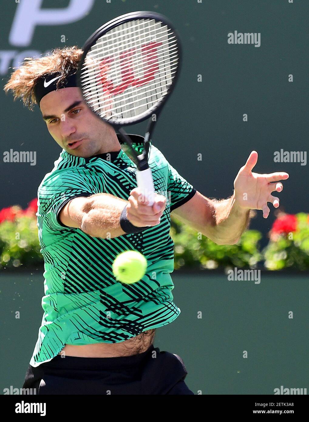 Mar 18, 2017; Indian Wells, CA, USA; Roger Federer (SUI) hits to Jack Sock  (USA) in his semi-final match in the BNP Paribas Open at the Indian Wells  Tennis Garden. Mandatory Credit: