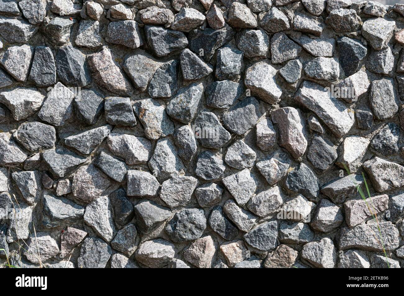 Stone wall background. Fence made of big stones Stock Photo - Alamy