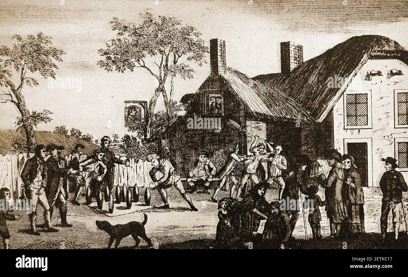 1802   An old engraving showing customers playing skittles behind a a thatched English inn. The inn sign indicates it may be called the 'King's Head'. Stock Photo