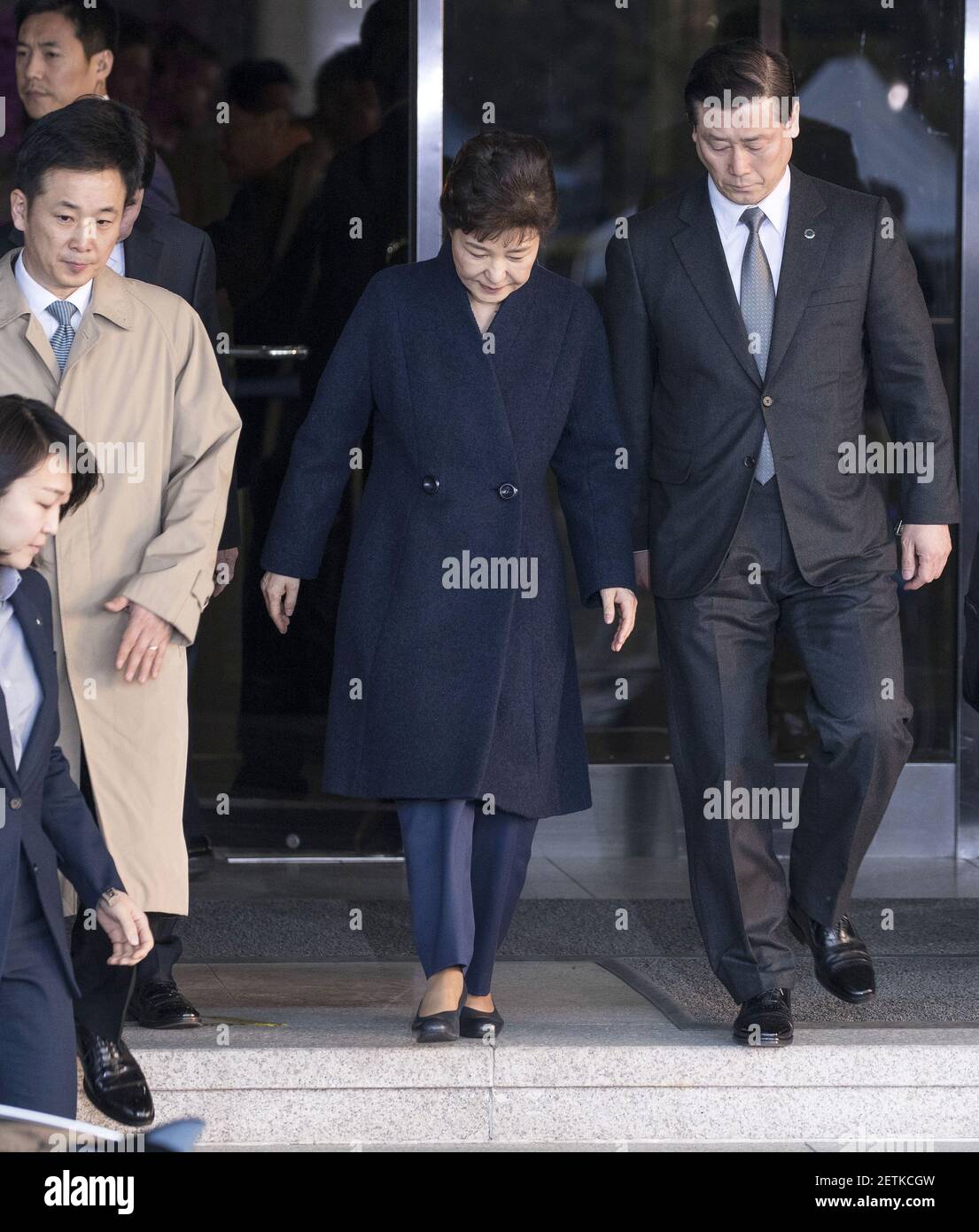 22 March 2017 - Seoul, South Korea : Former South Korean President Park Geun-hye, (center), leaves the prosecutors office in Seoul, South Korea on Wednesday, March 22, 2017. Park is set to be questioned by prosecutors for the first time over a corruption scandal that ended her presidency. Ousted South Korean leader Park Geun-hye pledged to cooperate with investigators before facing hours of questioning for the first time over a corruption scandal that ended her presidency. Photo Credit: Lee Young-ho/Pool *** Please Use Credit from Credit Field *** Stock Photo