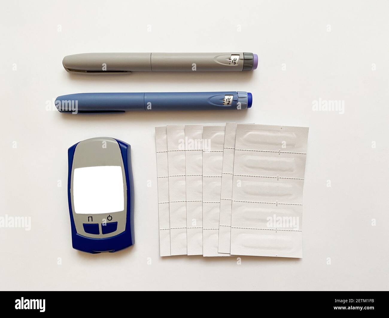 Insulin short, long, glucose meter and test strips on a white isolated