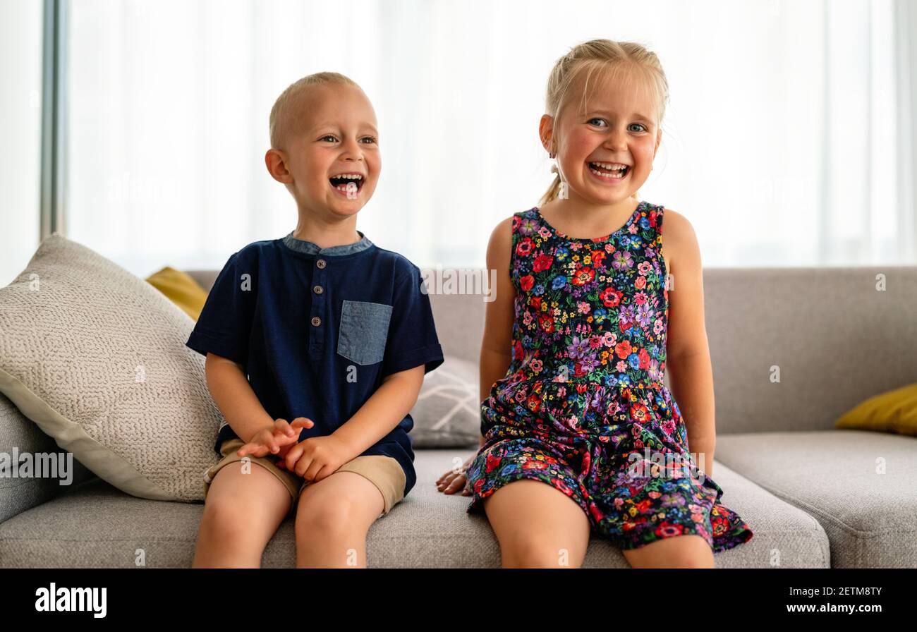 Preschool children boy and girl sit together. Happy childhood, parenting, kid concept. Stock Photo