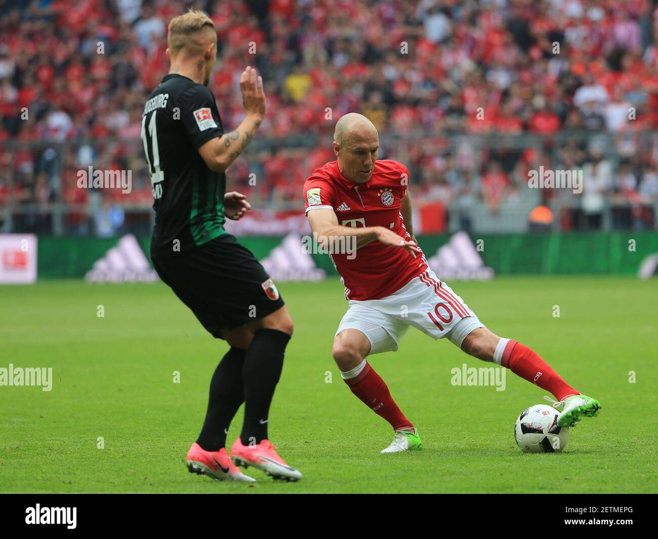20170401, 1.BL, FC Bayern vs FC Augsburg, Allianz Arena Muenchen, Fussball, im Bild: Jonathan Schmid (FC Augsburg) vs Arjen Robben (FCB) *Copyright by: Philippe Ruiz Oberbrunner Strasse 2 81475 MŸnchen, Tel: 089 745 82 22, Mobil: 0177 29 39 408 ( MAIL: philippe ruiz@gmx.de ) Homepage: www.sportpressefoto-ruiz.de (Photo by Xinhua/Sipa USA)  Stock Photo