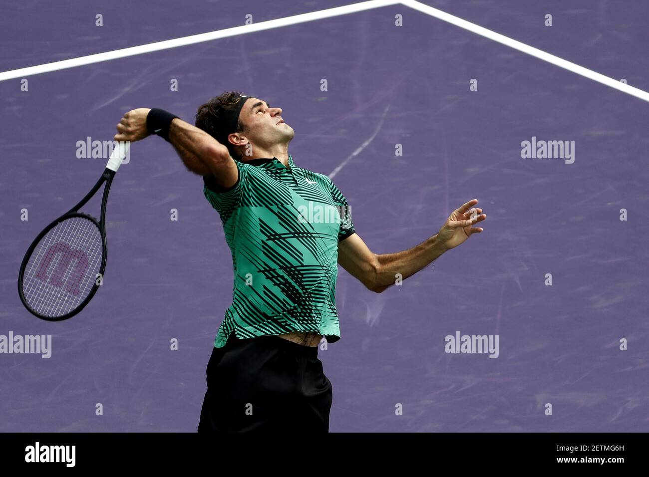 Apr 2, 2017; Key Biscayne, FL, USA; Roger Federer of Switzerland serves  against Rafael Nadal of Spain (not pictured) in the men's singles  championship of the 2017 Miami Open at Crandon Park