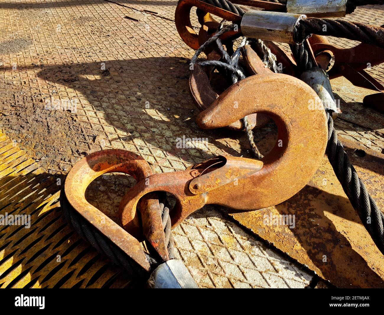 Chain hook of the tower crane for lifting cargo closeup. Rope slings