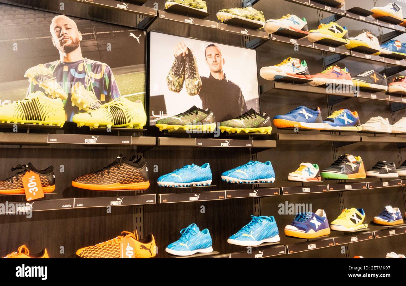 Puma football boots store, shop display with images of sponsored footballers, Neymar and Antoine Griezmann Stock Photo -