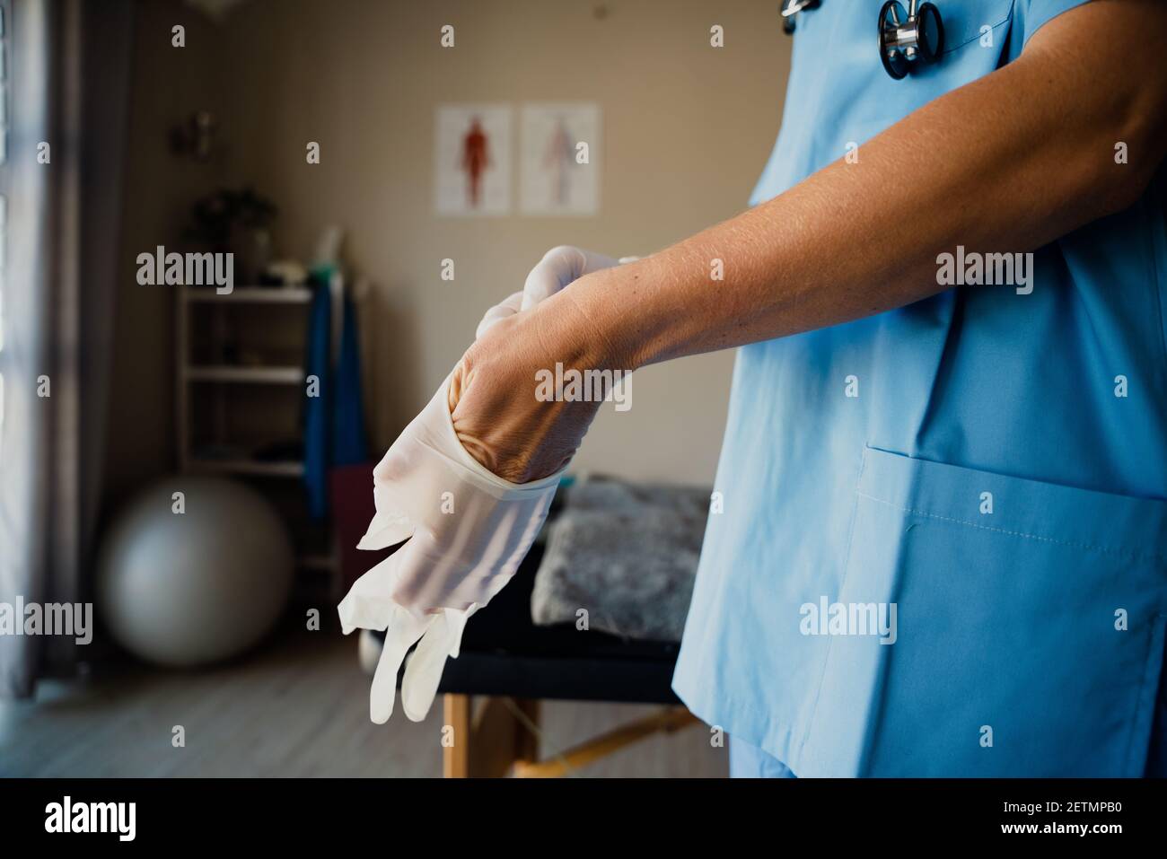Nurse putting on latex gloves hires stock photography and images Alamy