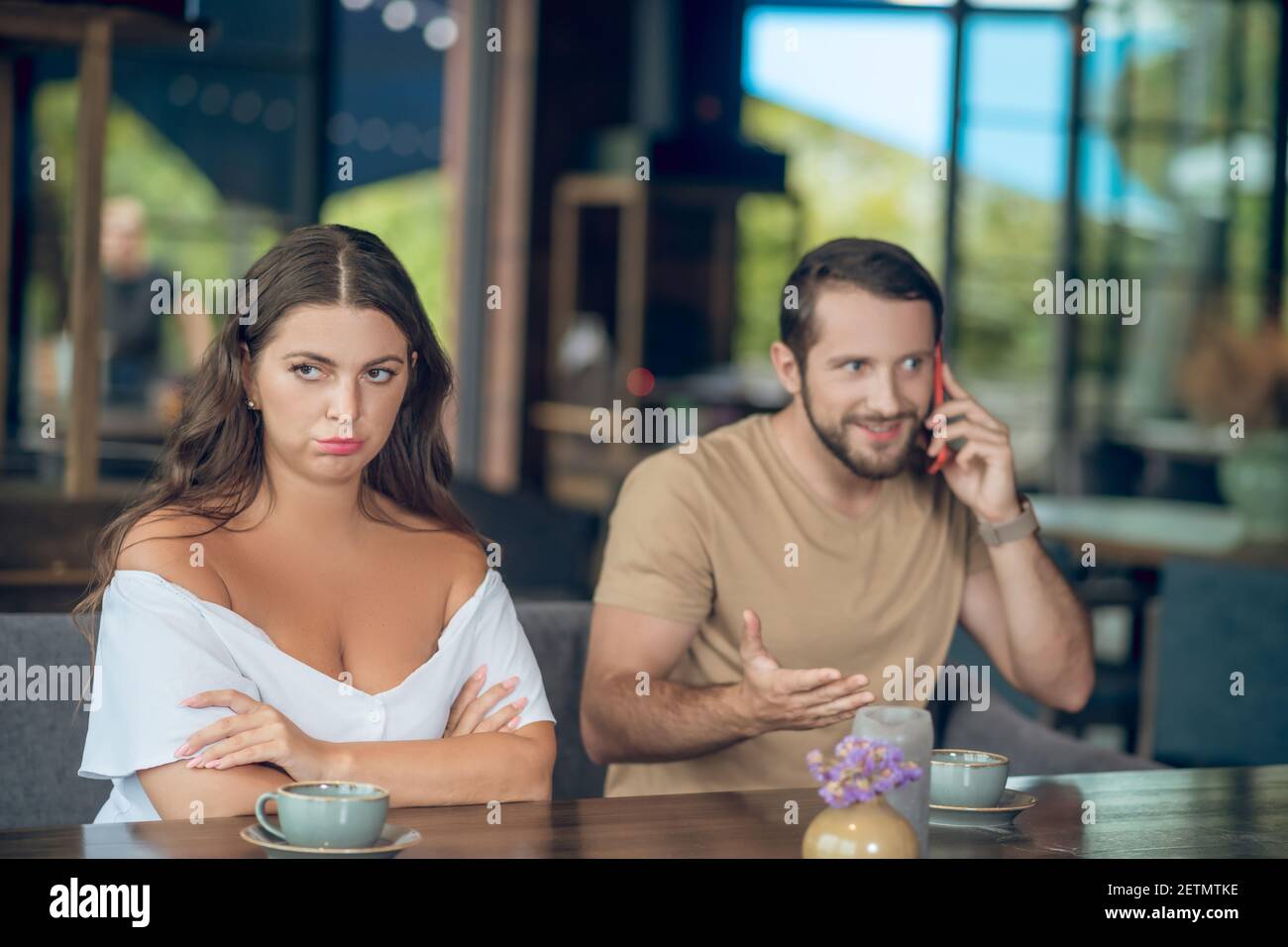 Woman talking inattentive man hi-res stock photography and images - Alamy