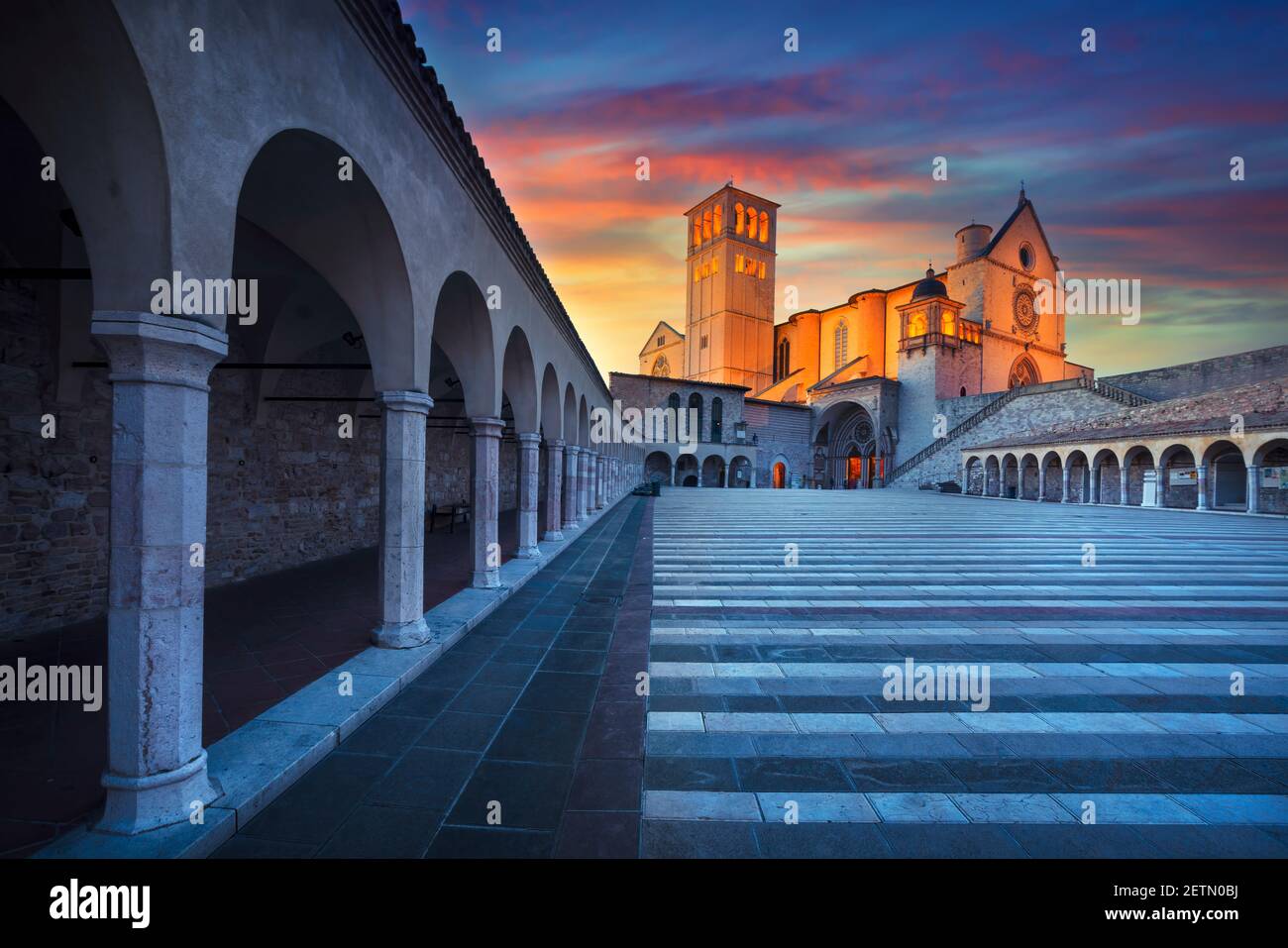 Assisi, San Francesco or Saint Francis Basilica church at sunset. Perugia, Umbria, Italy, Europe. Stock Photo
